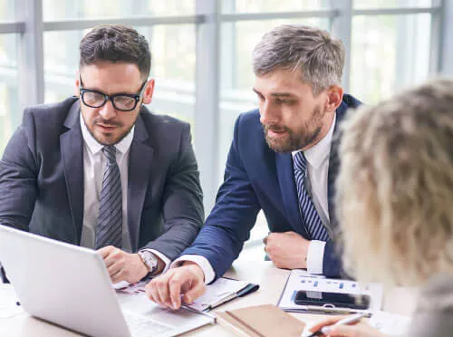 Business professionals reviewing financial documents together